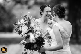 The couple share a quiet, natural moment behind a house at a privately owned farm in Monkton, Maryland, just after the ceremony, away from the crowd.